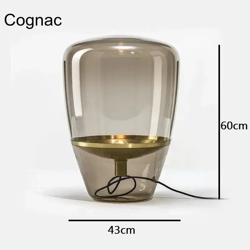 Modern smoked glass table lamp with a 60cm translucent amber balloons glass table body and polished brass accents