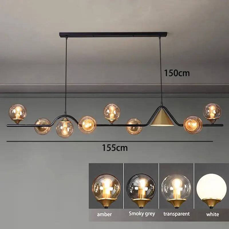 Modern black metal pendant light fixture with smoky grey glass globes and gold accent for dining room use