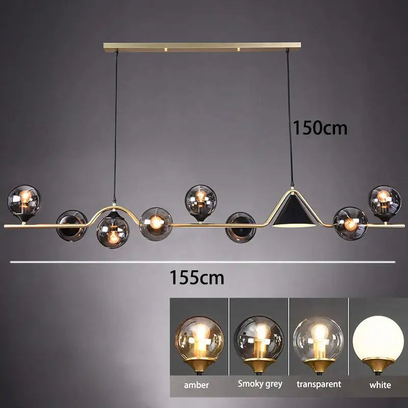 Modern pendant light with smoky grey glass and gold accents featuring multiple amber and white spherical globes for dining room