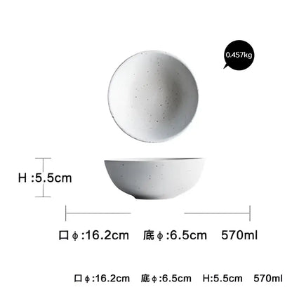 A white speckled ceramic plate set with a matte finish and rounded edges for modern dinner plate set use