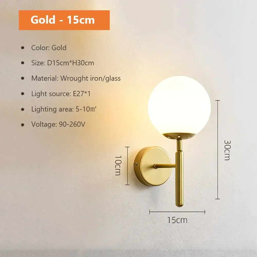 Modern spherical glass shade gold wall lamp featuring a wrought iron base and globe design for bedroom lighting