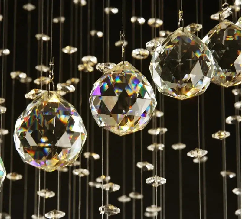 Modern spiral black and clear crystal pendant chandelier featuring decorbites crystal pendant spheres for bedroom decor