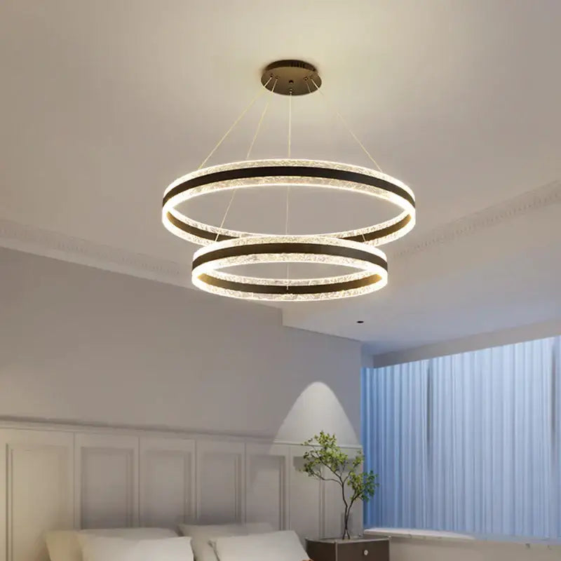 Modern spiral circle rings led chandelier with sleek black frame and clear crystal decorbites circle rings design for living room