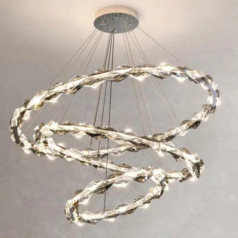 A modern multi-tiered decorbites crystal chandelier with interlocking LED crystal rings for living room decor