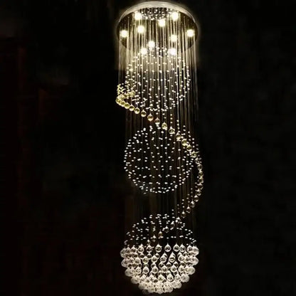 A modern decorbites crystal led chandelier with cascading clear glass beads in spiral tiers for dining room lighting