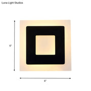 Modern square acrylic led wall sconce in black and off-white with warm white direct wired electric lighting for living room