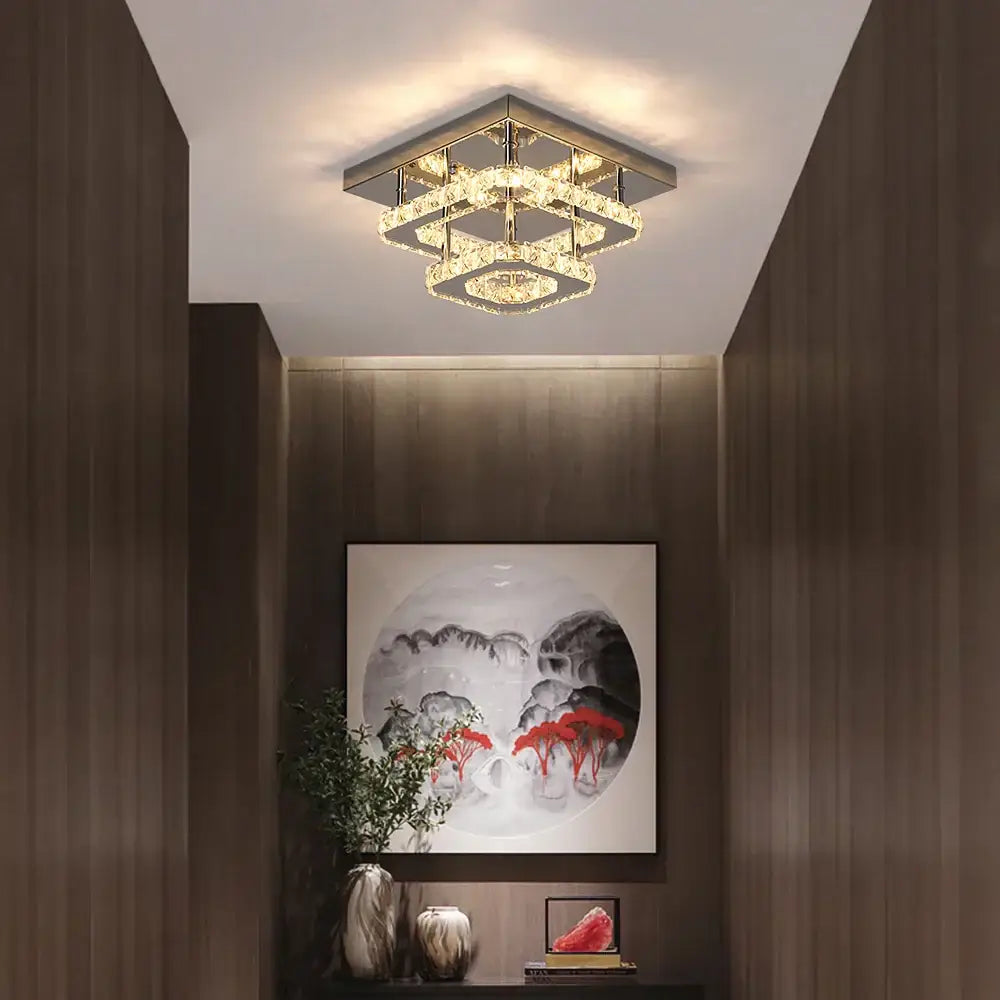 Modern square crystal ceiling chandelier by decorbites with geometric layered design and warm golden lighting for dining rooms