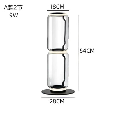A sleek modern stacked glass led floor lamp with black base and circular top rings for living room lighting