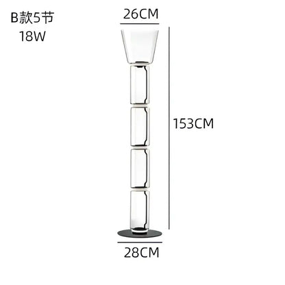 A tall modern stacked glass led floor lamp with a sleek segmented design and black circular base for living room lighting