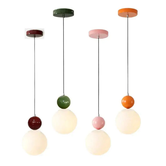 Modern stacked white glass globe pendant light with two matte spherical shades in dark red, green, pink, and orange for dining room