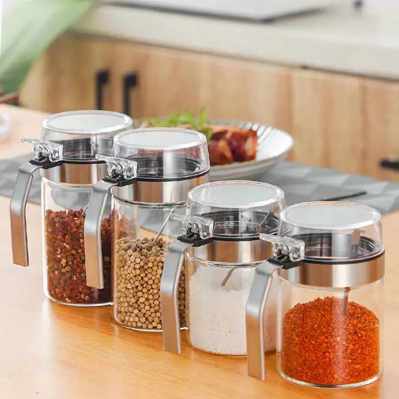Modern stainless steel and glass seasoning pot with clear glass seasoning jars and stainless steel lids for kitchen supplies