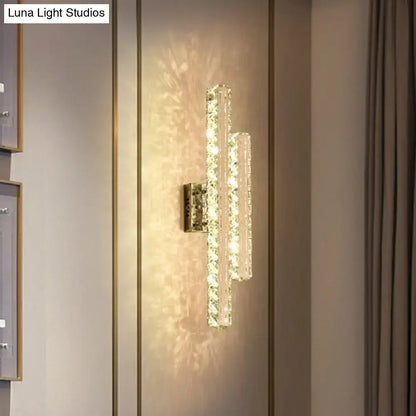 Modern stainless steel k9 crystal led wall mount light with two faceted glass bars emitting warm glow for living room