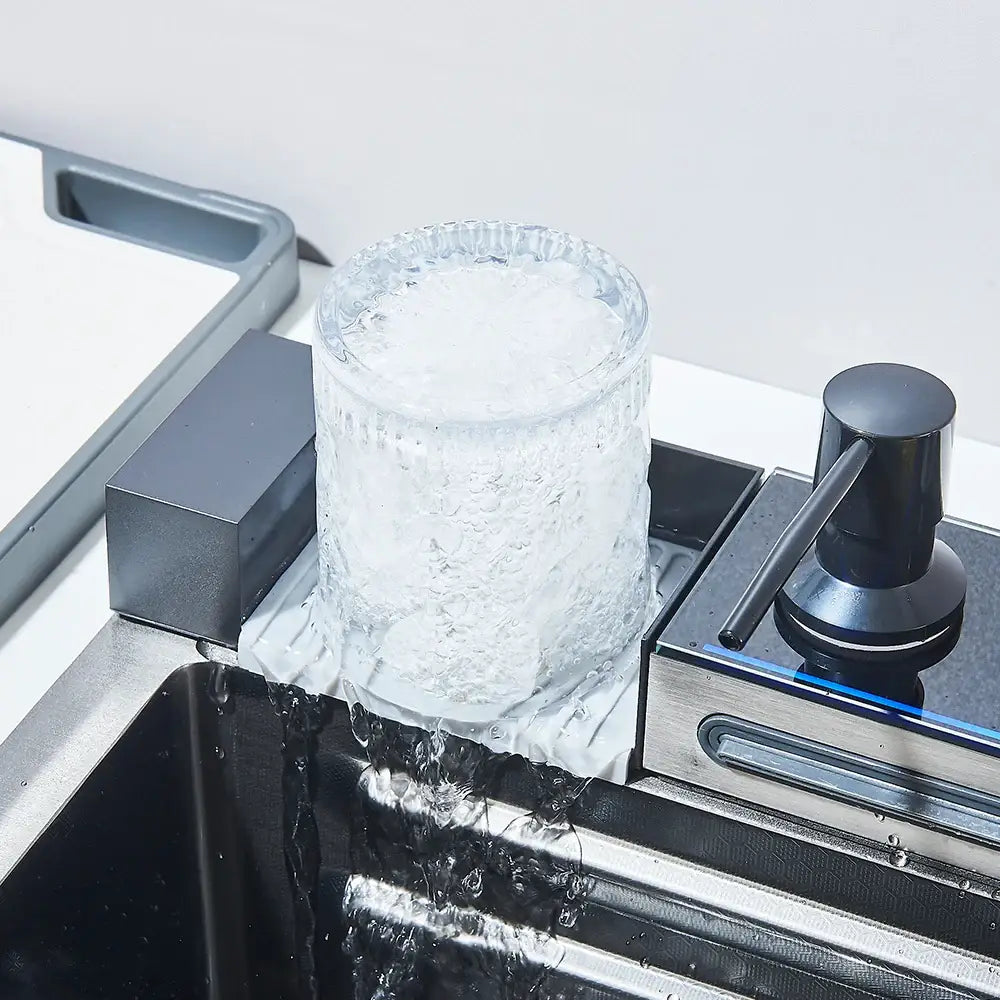Clear textured glass ice cube tray designed for modern stainless steel waterfall kitchen sink with digital display