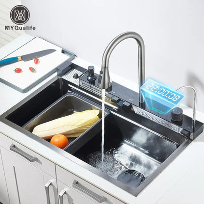 Modern stainless steel waterfall kitchen sink faucet with sleek curved spout and integrated digital display showing temperature and time