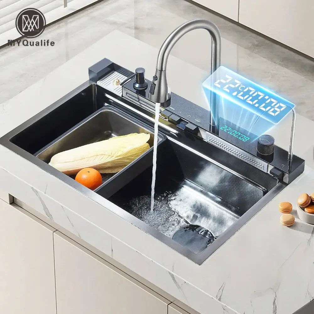 Modern stainless steel waterfall kitchen sink with sleek curved faucet and integrated digital temperature display