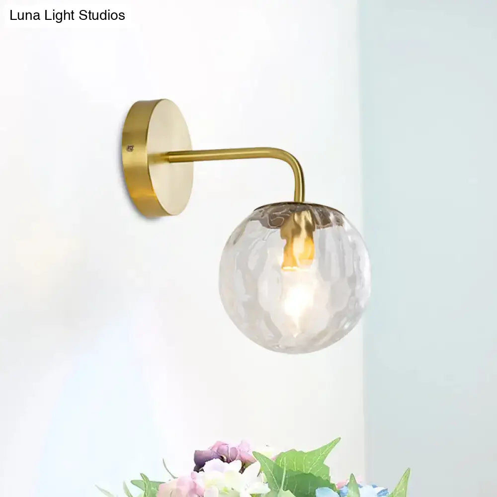 Modern style gold color wall sconce with hammered clear textured glass globe for living room lighting