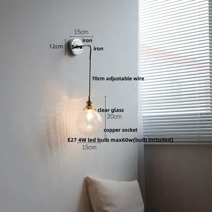 Modern sunset glass led wall sconce with clear glass globe pendant light, copper socket, and adjustable iron arm for decorbites ceramic led wall