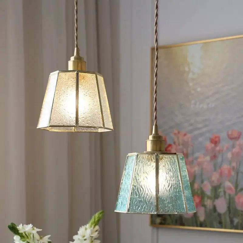 Two hanging pendant lamps with amber and teal decorbites copper glass led shades and brass frames for dining room decor