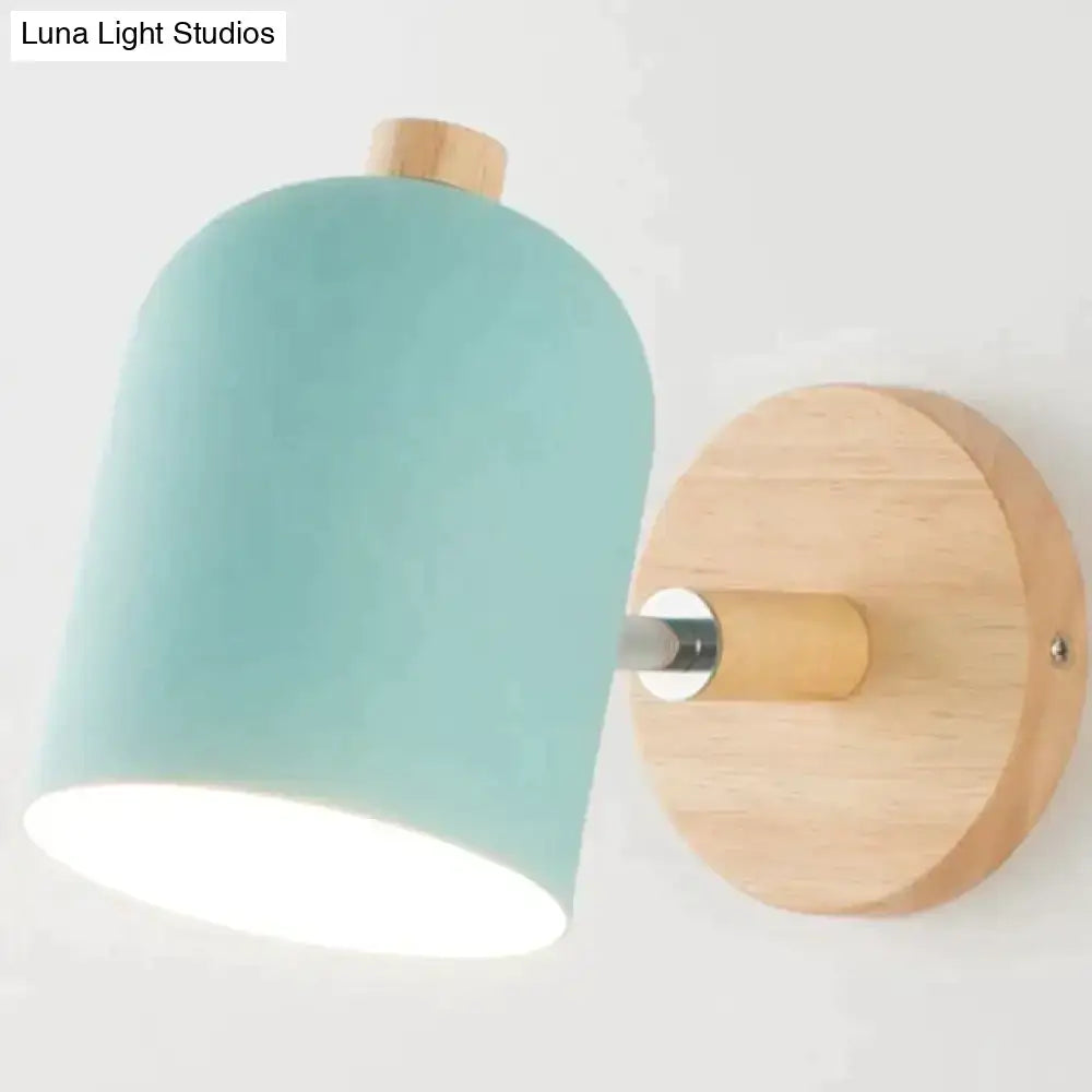Modern teal and wood wall lamp featuring a mint green ceramic lampshade with a natural wood base and mounting plate