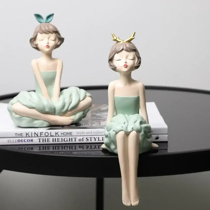 Two mint-green resin bowknot girl figurines with bunny ears and gold antlers for modern living room decor