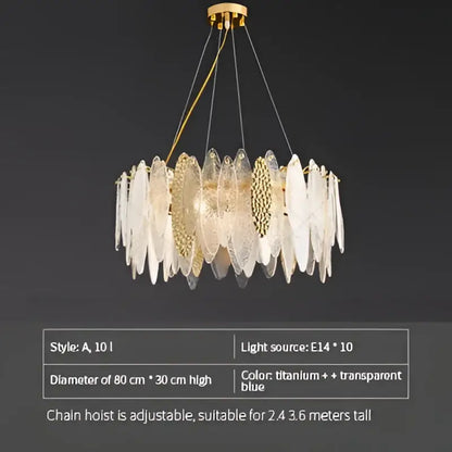 Modern teal and gold glass chandelier light with translucent blue and clear leaf-shaped shades for living room