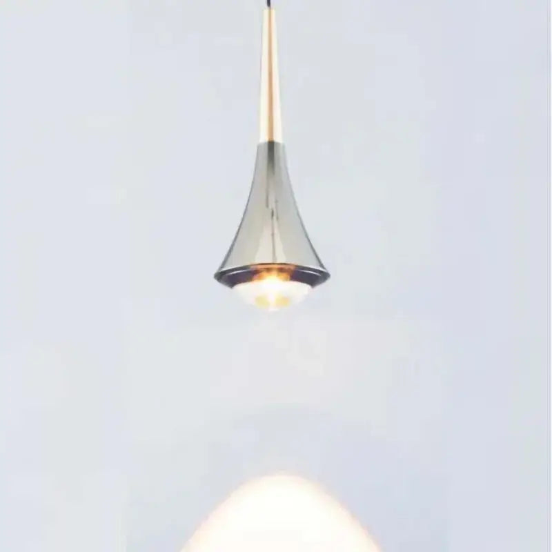 Modern teardrop pendant light with metallic gold stem and chrome conical shade warm cord pendant light for dining room