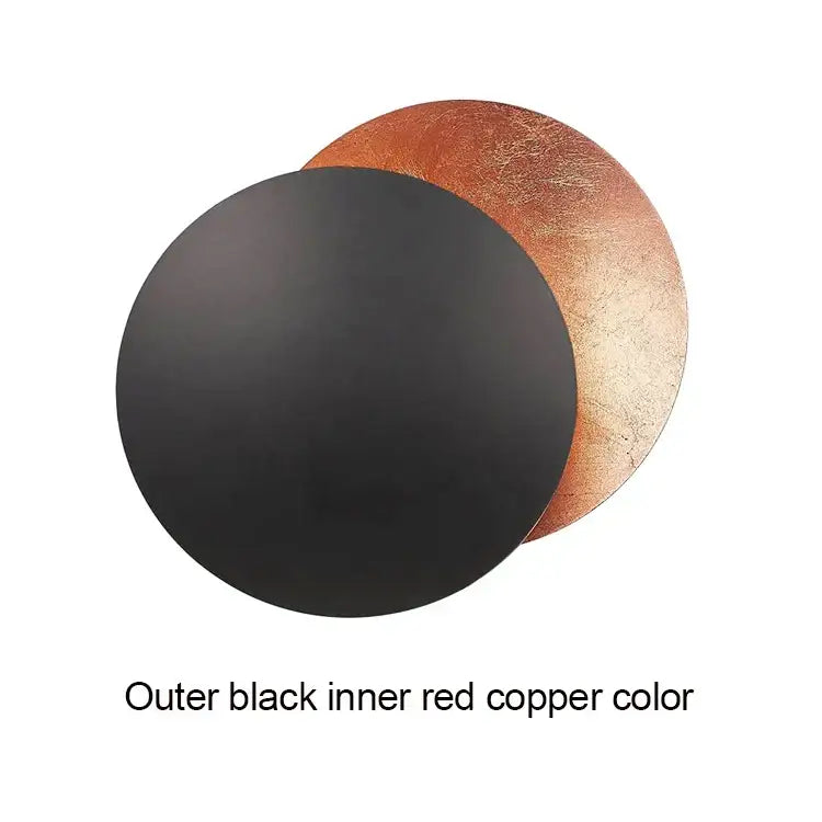 Modern textured eclipse round wall lamp with matte black outer surface and textured red copper inner layer for bedroom use