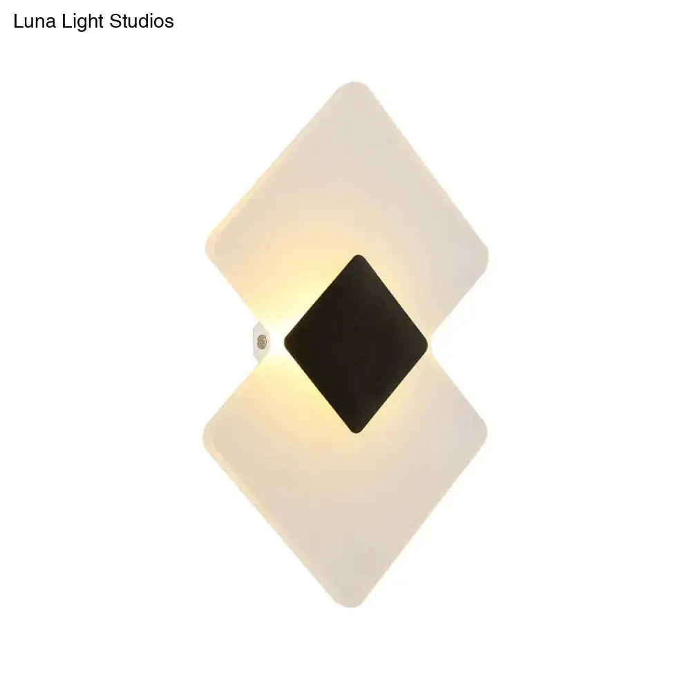 Modern textured silver and black direct wired electric wall sconce with diamond-shaped frosted acrylic panels