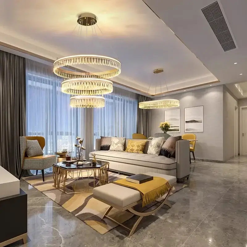 Modern three tier gold crystal led chandelier with circular design and warm lighting for dining room decorbites modern crystal