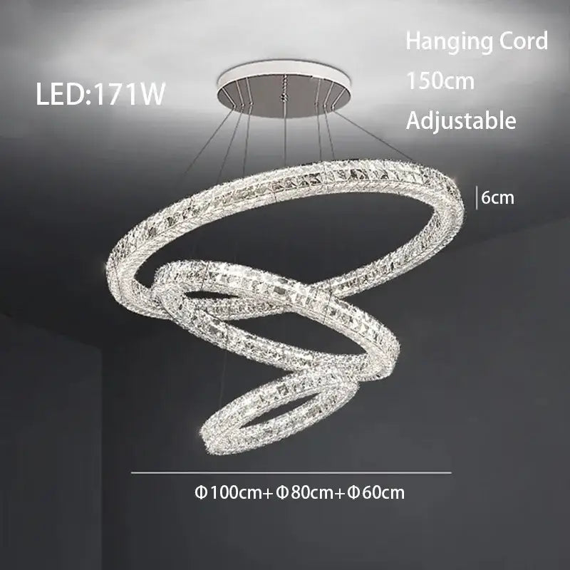 A modern decorbites crystal led chandelier with three interlocking crystal rings in a multi-tiered swirling design