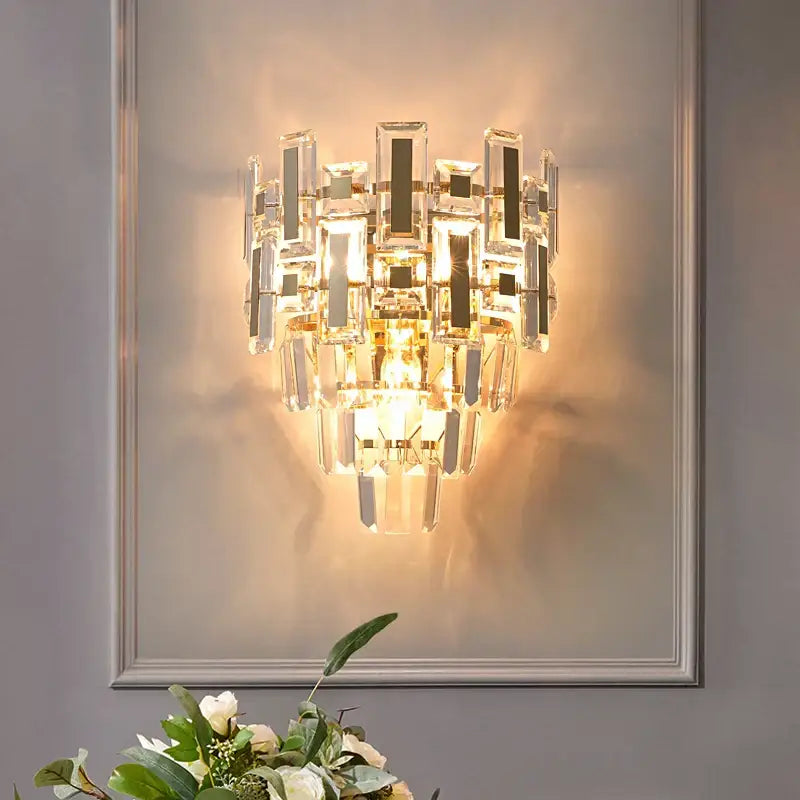 Modern tiered clear and dark crystal wall lamp with warm golden light for bedroom decorbites crystal wall lamp