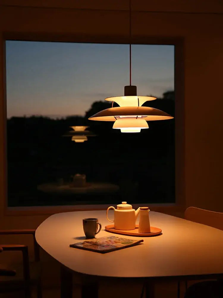Warm-toned layered glass hanging light suspension lamp with sleek modern design by decorbites danish designer for dining room