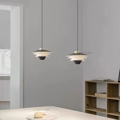 Modern black and white layered pendant lights with sleek minimalist design featuring cream wind milk glass for kitchen dining