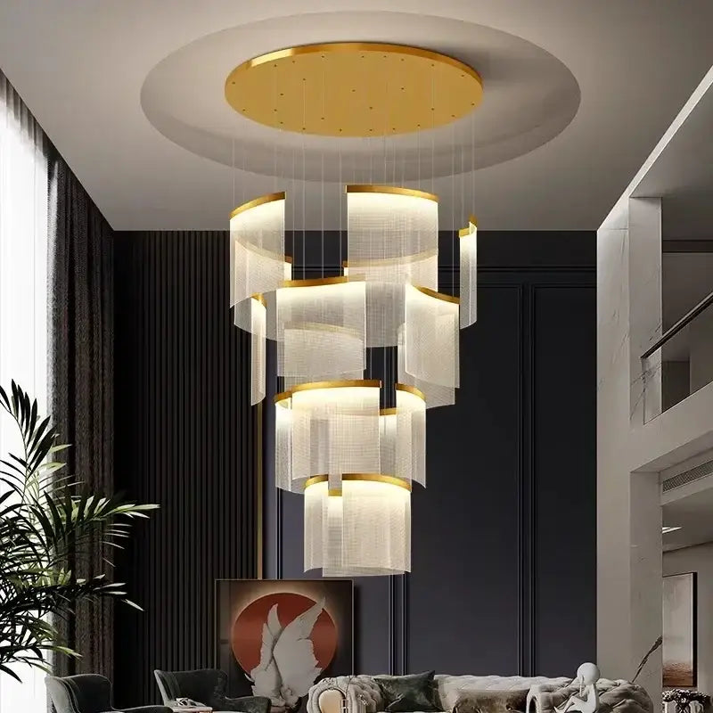 A modern tiered gold led ceiling chandelier with translucent cylindrical shades for an elegant dining room ceiling chandelier