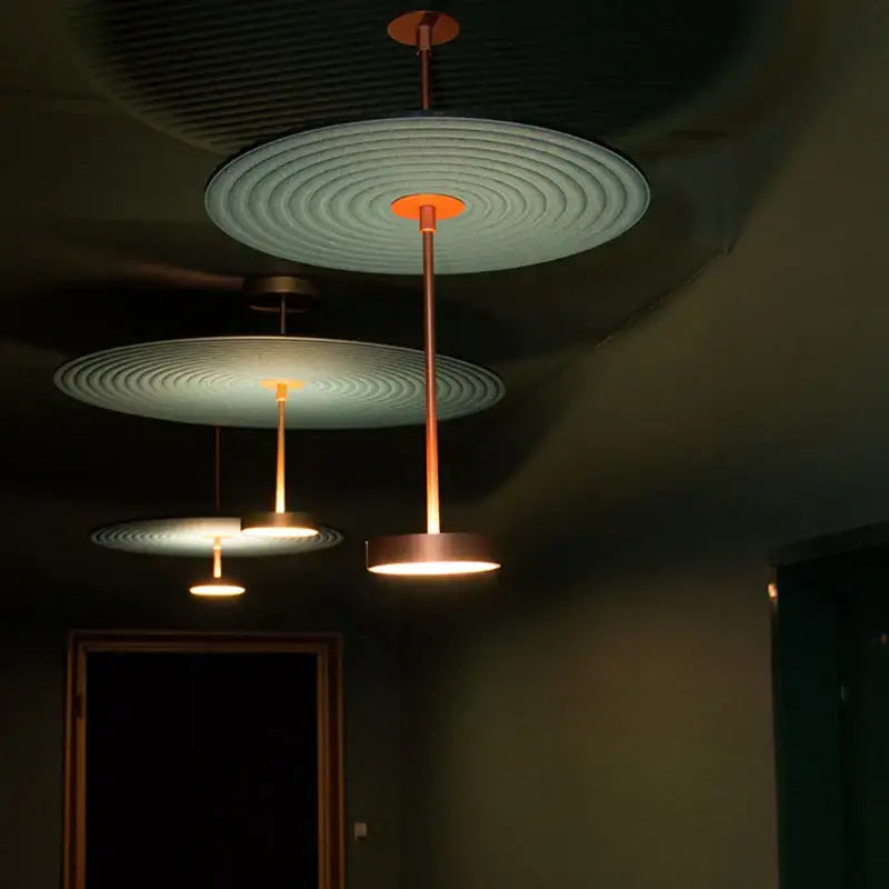 Modern tiered maroon and teal dimmable cotton chandelier with copper-toned pendant lights emitting warm glow by decorbites dimmable cotton