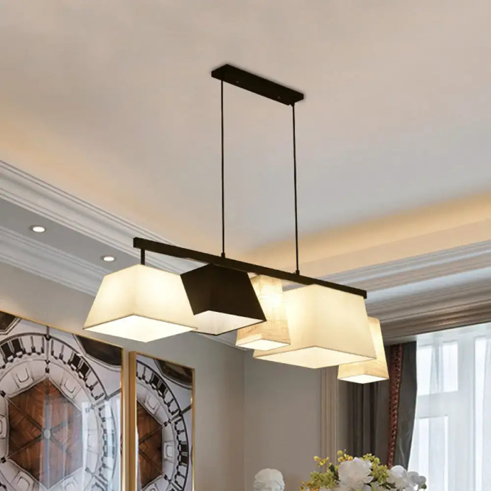 Modern black metal hanging lamp with three off-white trapezoid fabric shades for island light or ceiling light use
