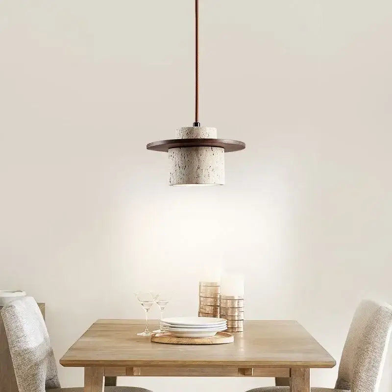 Modern travertine and walnut pendant light with textured off-white concrete body and bulb included cord pendant design