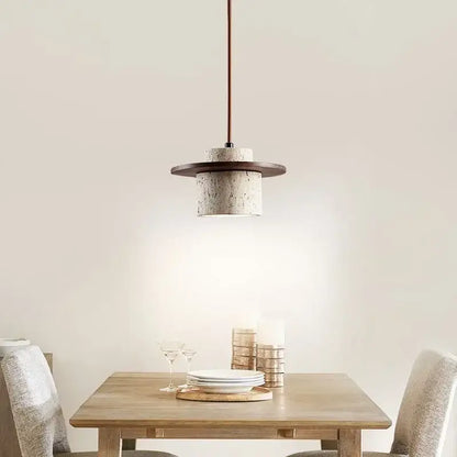 Modern travertine and walnut pendant light with textured off-white concrete body and bulb included cord pendant design