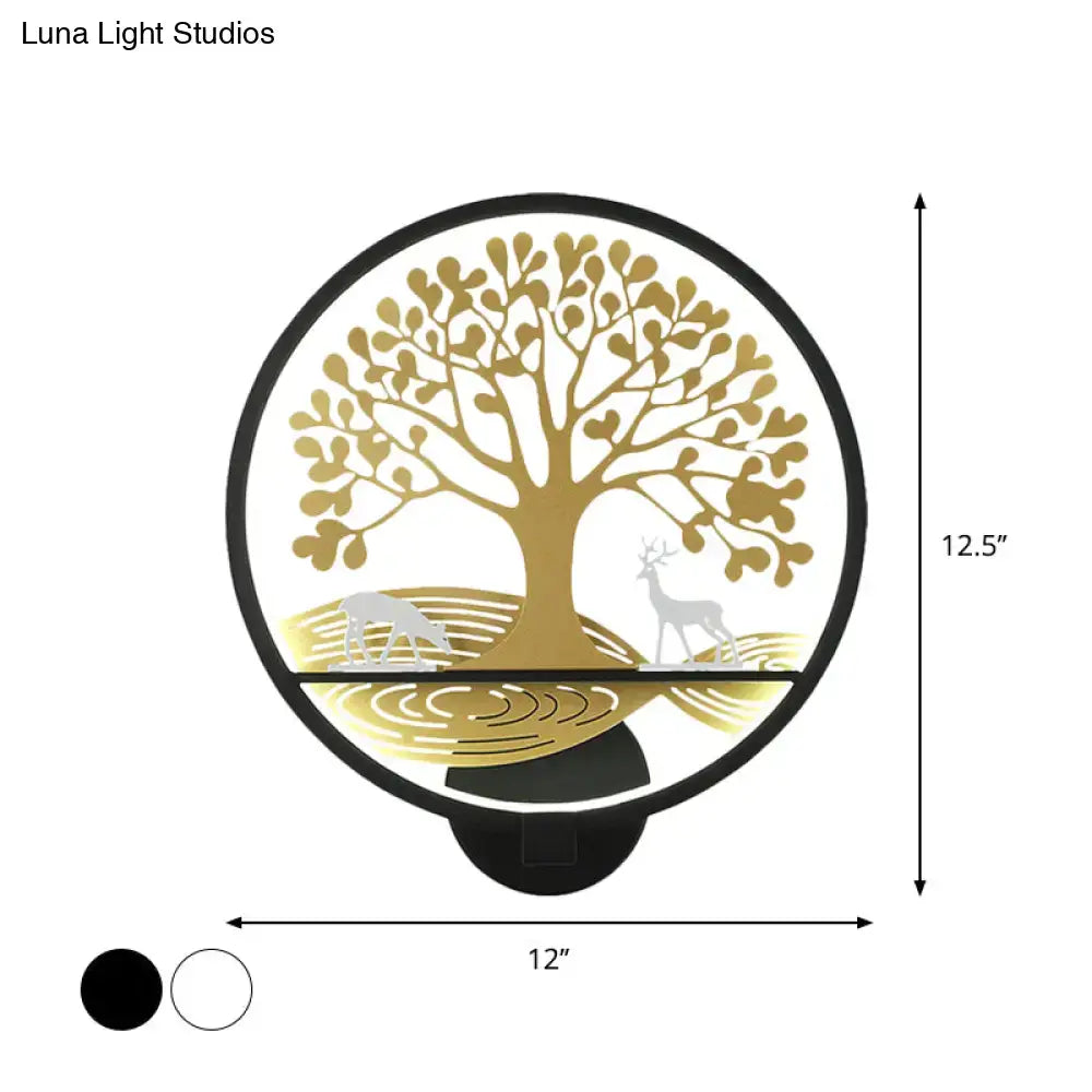 Modern wall lamp featuring a gold tree of life design with deer silhouettes and black trim for bedroom mural lighting