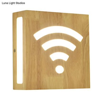 Modern tree pattern bamboo wall light with light wood finish and glowing wi-fi cutout direct wired electric wall light