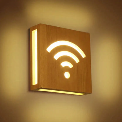 Modern tree silhouette wooden square flush mount corridor wall sconce with warm-toned wood and glowing wi-fi symbol design