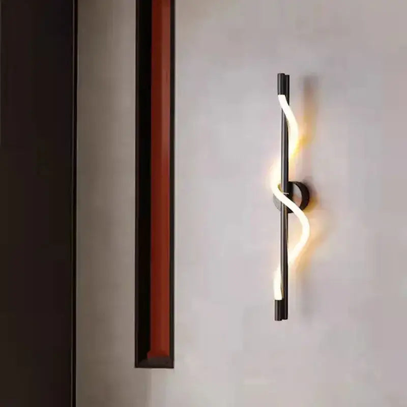Modern twisted black dimming wall lights with sleek curved led strip emitting warm white light for bedroom decorbites dimming wall