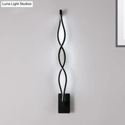 Modern twisted black led wall sconce with sleek design for bedroom lighting as a stylish led wall fixture