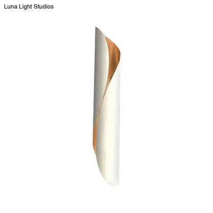 Modern twisted black and white wall lamp with sleek white exterior and warm copper interior for 110v-120v use