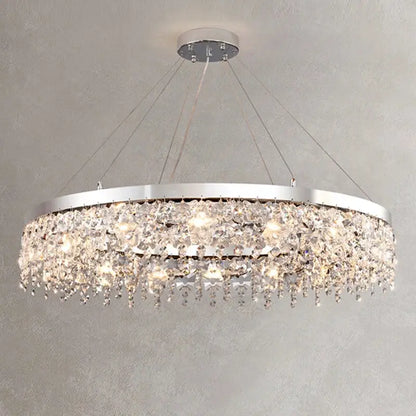 Modern two tier chrome decorbites crystal chandelier with cascading clear droplets illuminated by warm lights for living room