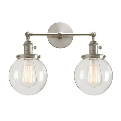 Brushed nickel double ball heads wall sconce with clear glass shades and exposed filament bulbs for bedroom lighting