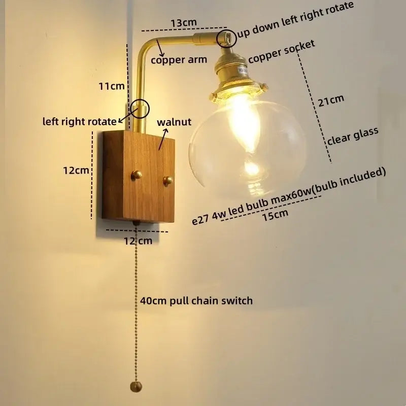 Modern walnut copper wall sconce with brass-finished copper arm and clear glass globe stair light fixture