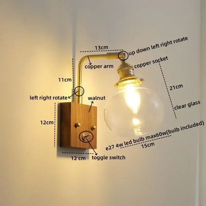 Modern walnut copper wall sconce with brass arm, clear glass bulb, and walnut wood base for stair lighting