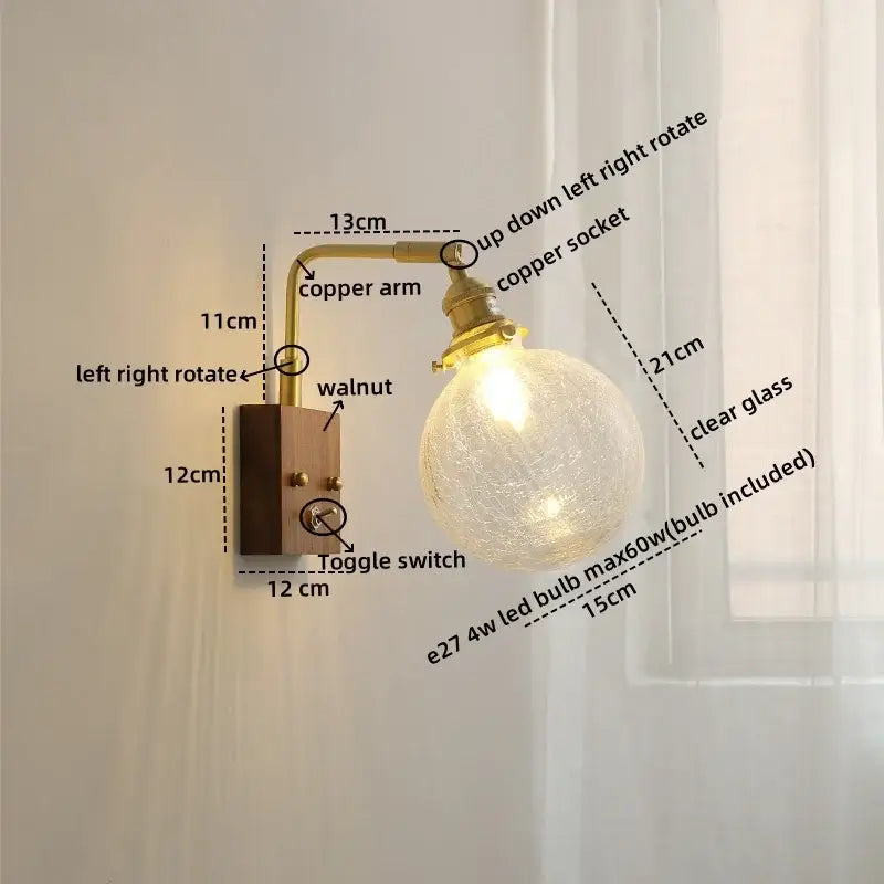 Modern walnut copper wall sconce with clear glass globe bulb, adjustable arm, and warm-toned copper finish for stairs