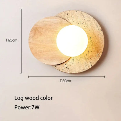 Modern walnut and cork led wall lamp with two overlapping circular wooden discs framing a glowing bulb in white